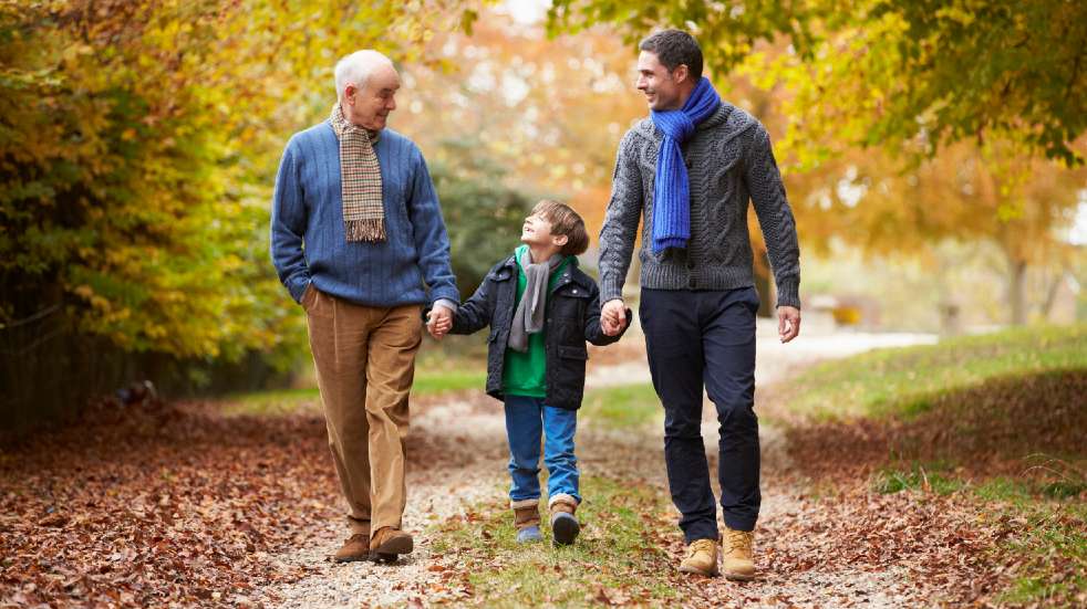 Quality time grandfather with son and grandson walking